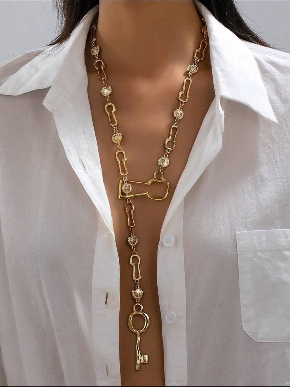 Sculptural Gold Key Lariat Necklace with Crystal Accents